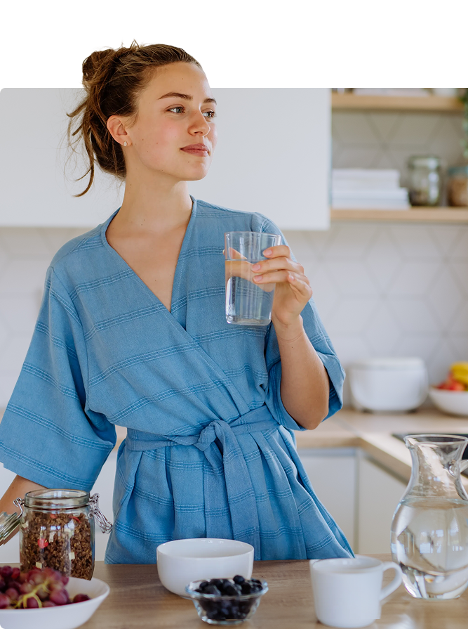 Woman holding a glass of water