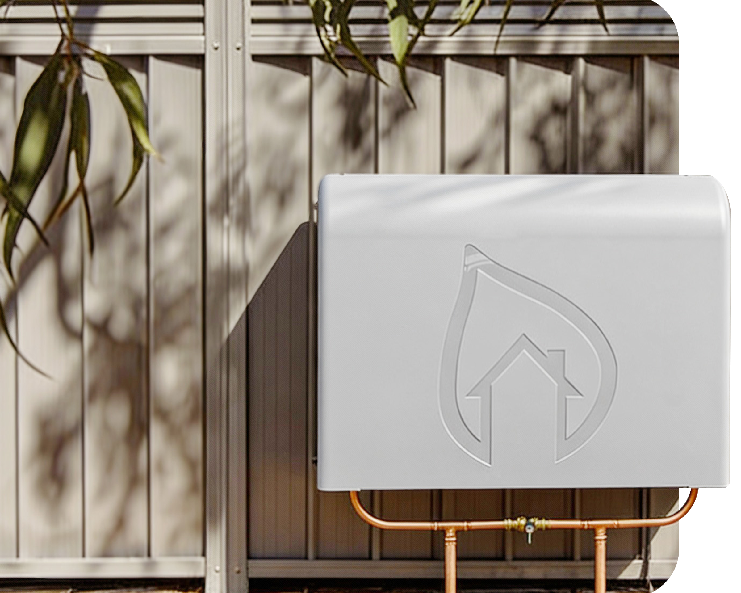 Front view of a residential whole home water filtration system installed outdoors by a cream fence.